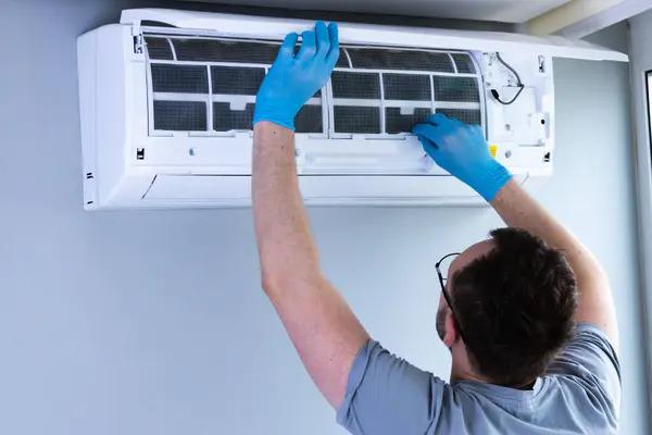 Skilled Technicians Solving Portable Air Conditioner Problems